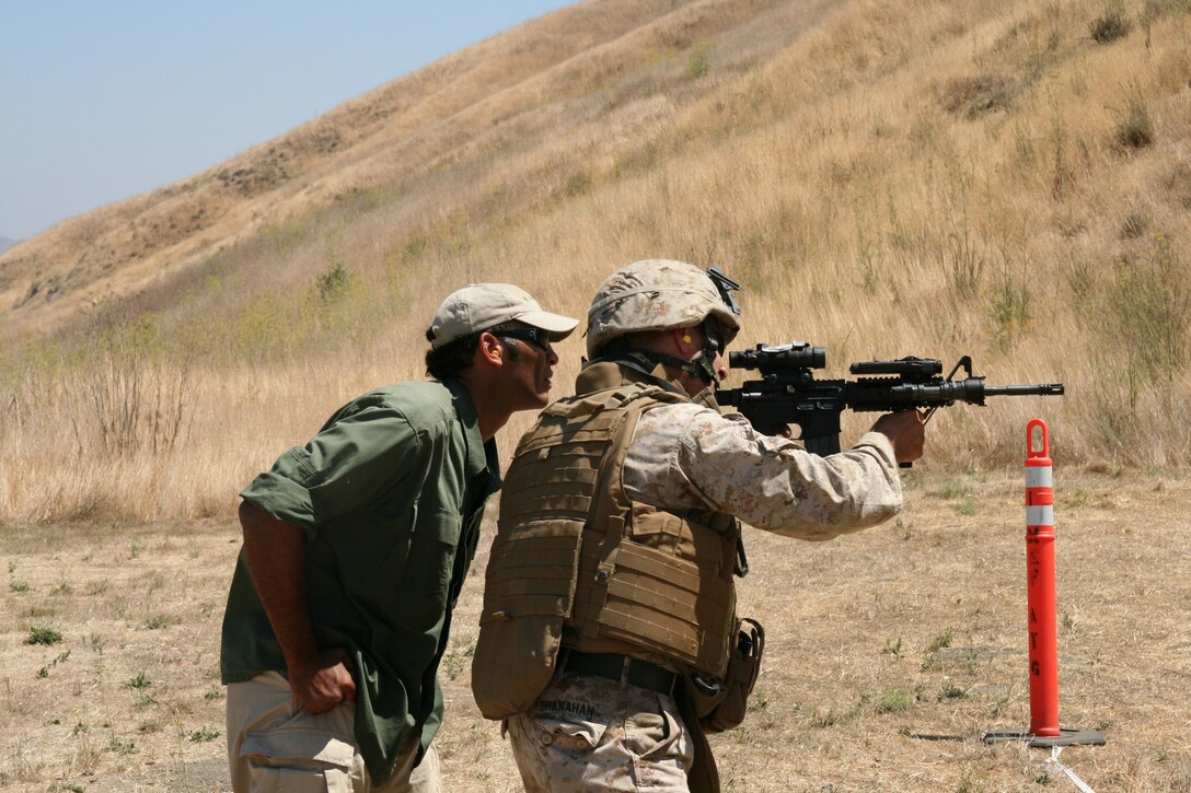 Lt. Col. Tim Shanahan, the military transition team leader from 2nd Battalion, 25th Marine Regiment, practices shooting from the standing position during a small arms familiarization training class at Camp Pendleton, Calif., Aug. 1.  Shanahan and his Marines are about half way into a 3-month MiTT training program to prepare them for their upcoming deployment to Iraq.